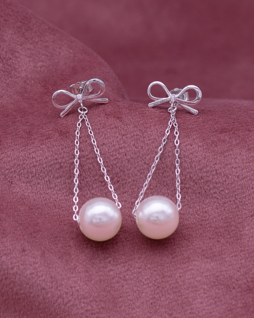 Silver Graceful Bow Pearl Drop Earrings