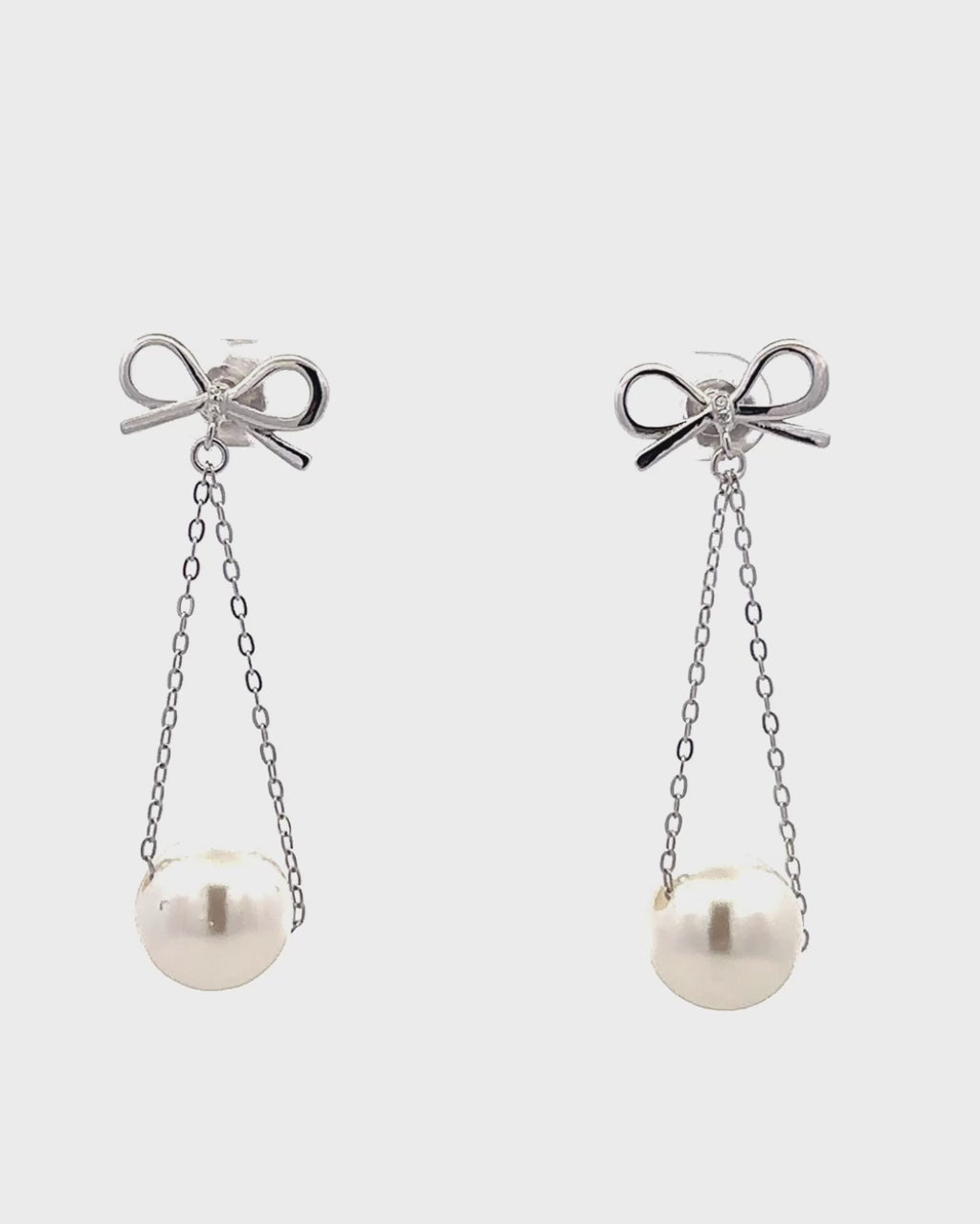 Silver Graceful Bow Pearl Drop Earrings