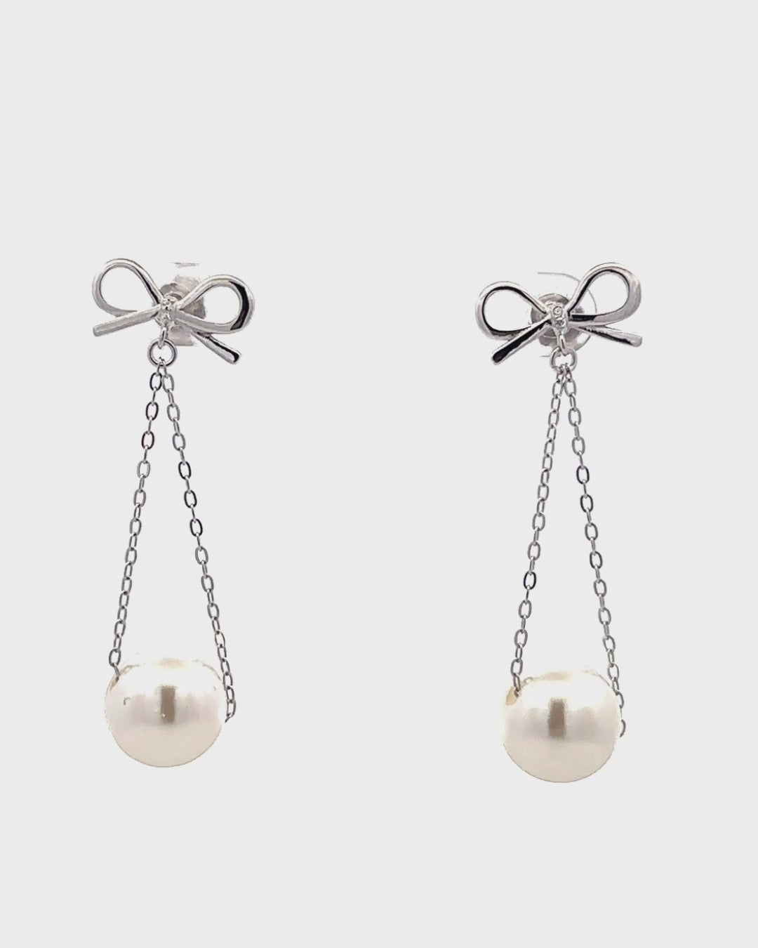 Silver Graceful Bow Pearl Drop Earrings